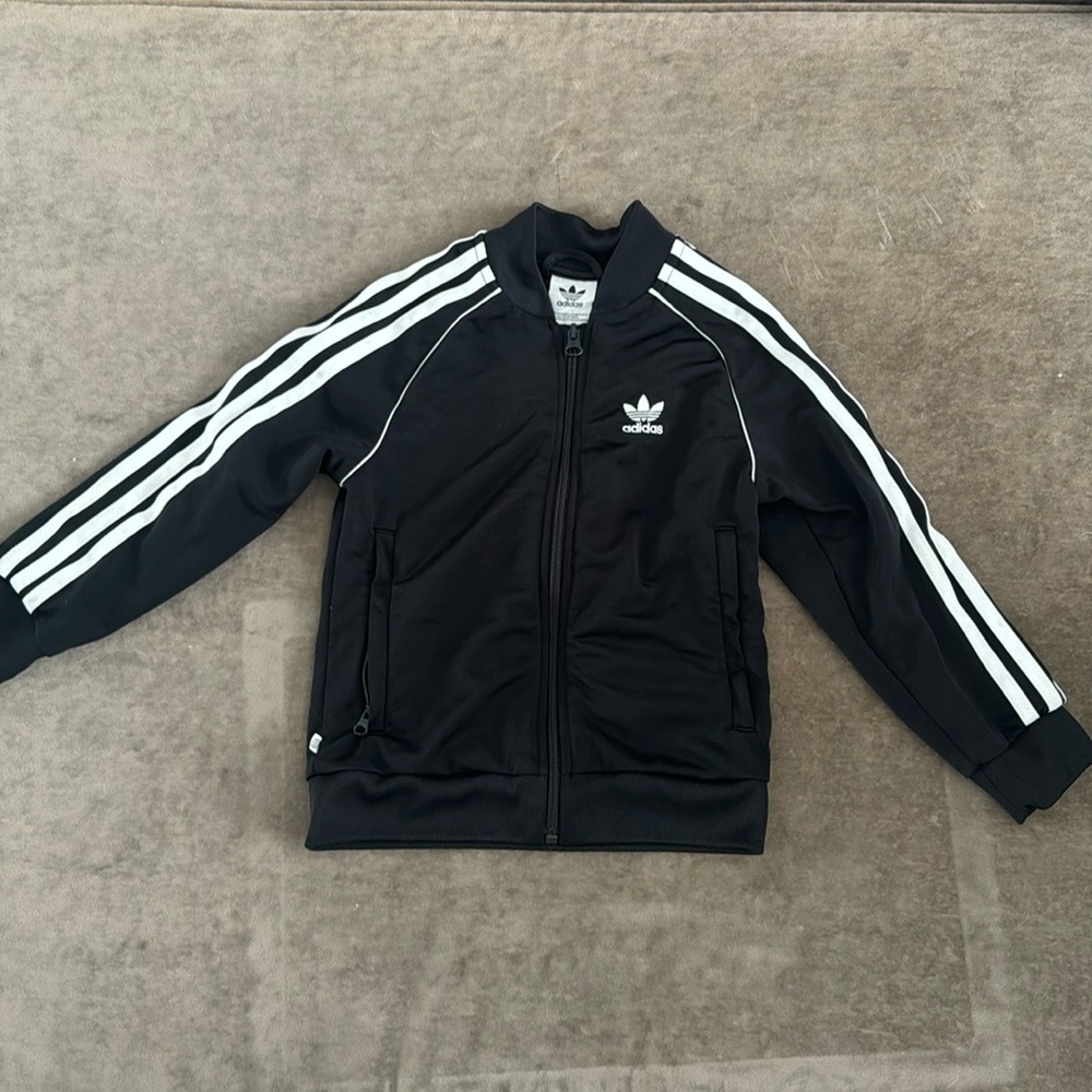 Adidas kids track jacket. Zip up front. Color- black/white. Size- XXS (5-6yr)
